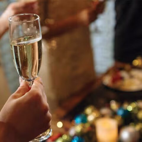 close-up photo of a woman’s against a backdrop of New Year ornaments
